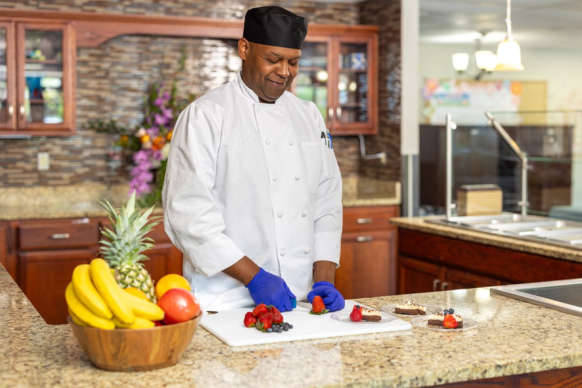 PACS-300x200-food1 Chef cutting strawberries at Cedar Creek Post Acute